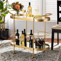 Kamal Glam Brushed Metal And Mirrored Glass 2 Tier Mobile Wine Bar Cart Gold - Baxton Studio 19 Kamal Glam Brushed Metal And Mirrored Glass 2 Tier Mobile Wine Bar Cart Gold - Baxton Studio -Living Space Shop GUEST 034e04a5 db63 474b 9d05 6c159816da1c