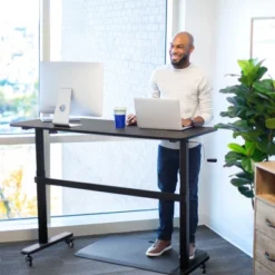 Tranzendesk Standing Desk With Clamp-On Shelf - 55" Sit To Stand Workstation With 55” Monitor Stand – Maple - Stand Steady -Living Space Shop GUEST 363ef1a7 35cf 4bd6 a3ab e064a94f49a2